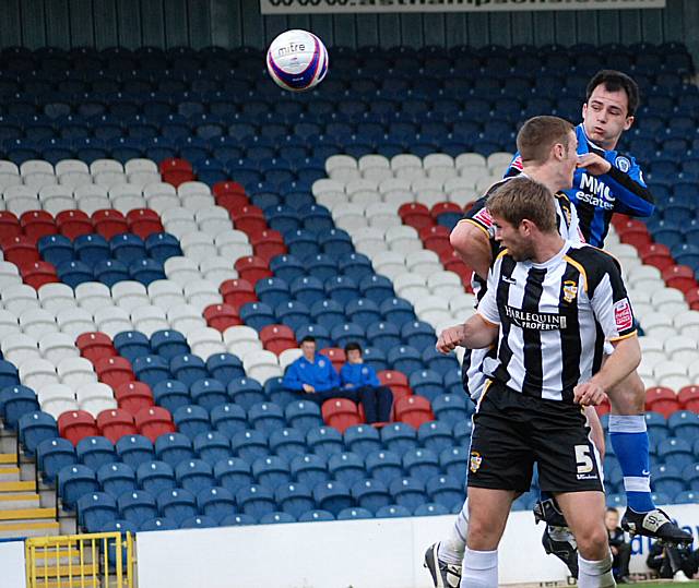 Dagnall directs a header on goal.