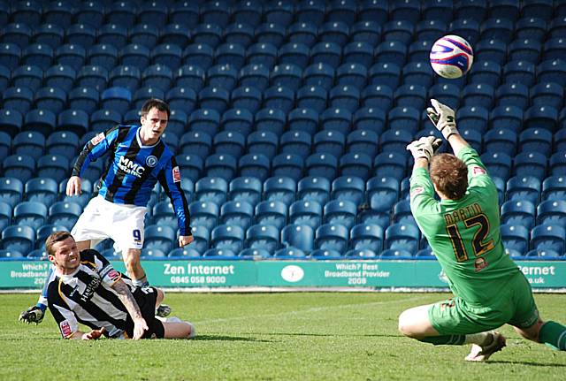 Chris Martin turn's Dagnall's drive over the crossbar.