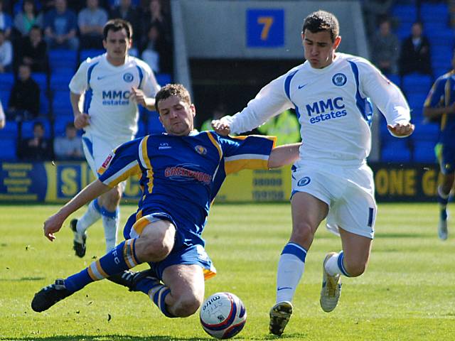 Graham Coughlan tackles Adam Rundle.