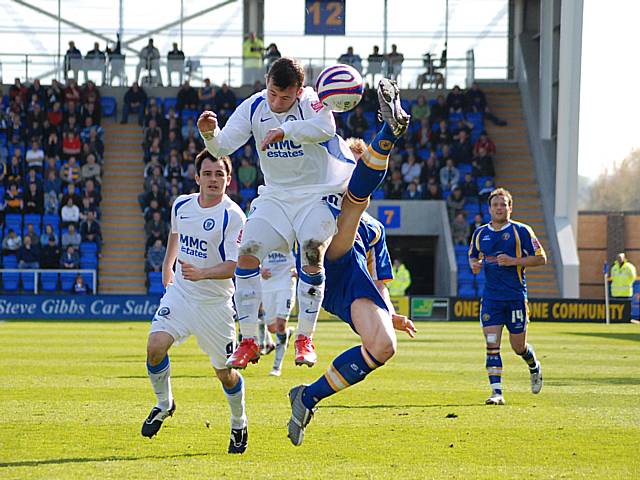 Adam Le Fondre tries to block a spectacular clearance.