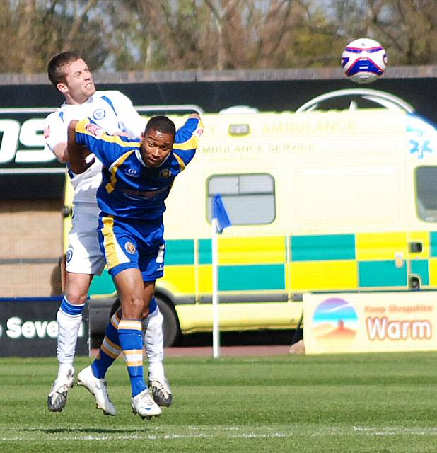 Tom Kennedy wins a header above Chris Humphery.