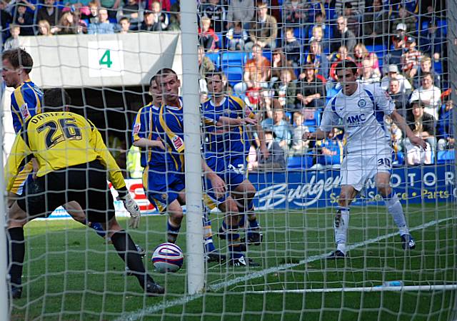 Daniels blocks Buckley's low shot with his foot.