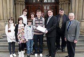 PETITION: (l to r) Emma Beasley (15), Grace Beasley (15), Josh Martin (16), Andrew Beasley (13), Rob Hull (14), Jon Smith (15) handing the petition over to Councillor Matt Colledge (Chairman of GMITA), Councillor Keith Whitmore (Vice Chairman of GMITA), and Councillor Norman Critchley (Bolton member of GMITA).