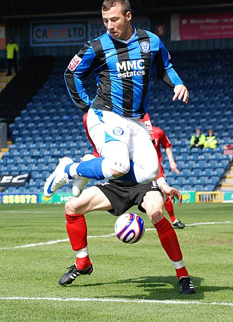 Adam Le Fondre looks to flick the ball on in the Darlington box.