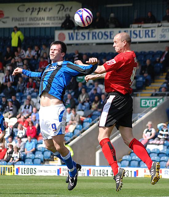 Alan White wins a header against Dagnall.