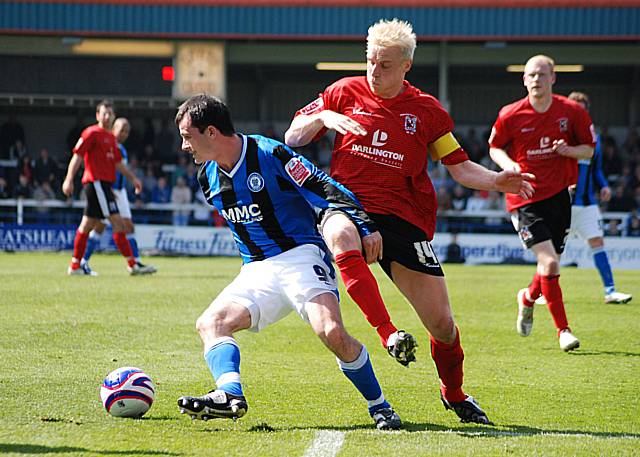 Dagnall turns away from Ricky Ravenhill.