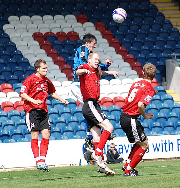 Dagnall wins a header against Kennedy.