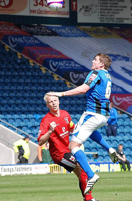 Ciaran Toner rises for an aerial ball.