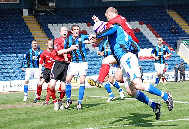 Dagnall and White tangle at the near post.