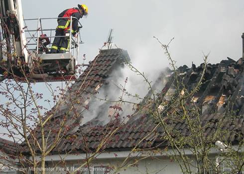 Fighting flames: Crews travelled from as far as Bury and Hyde to bring the fire under control