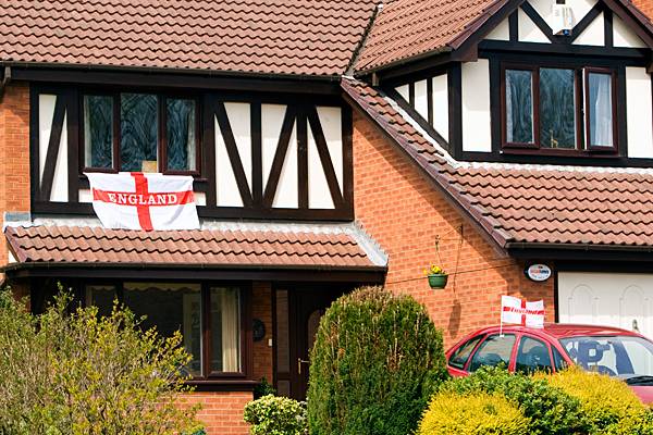 Houses across town are proudly flying their flags.