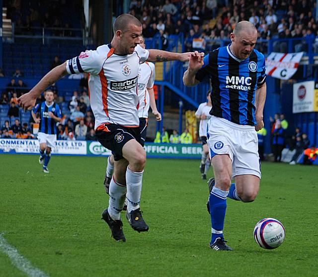 Jones holds the ball away from Keane.