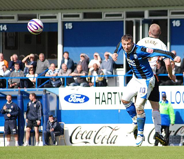 Adam Le Fondre nods the ball on.