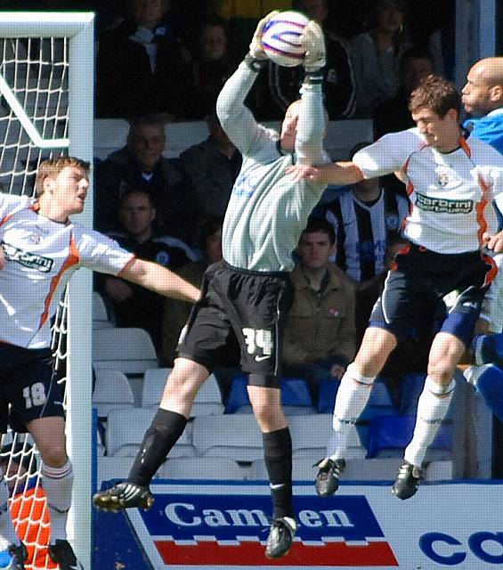 Frank Fielding gathers a Luton cross.