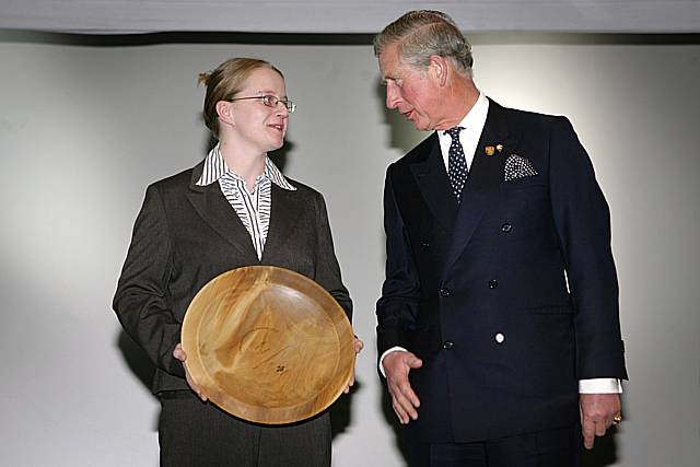 Lisa Daly receives her award from the Prince of Wales.