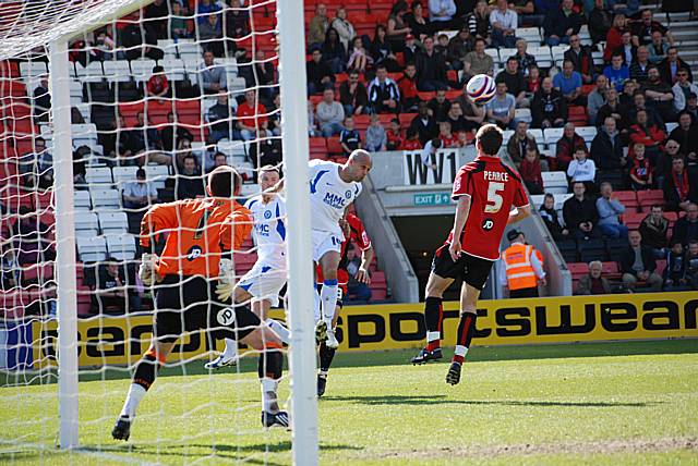 Lee Thorpe heads the ball across goal at the back post.