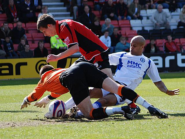 Lee Thorpe gets in a tangle with Jason Pearce and Shwan Jalal.