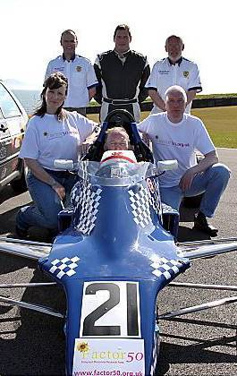 On your marks...Factor 50 fund-raisers Gillian Nuttall and Andy Worthington with some of the drivers and marshals from Formula Ford NW