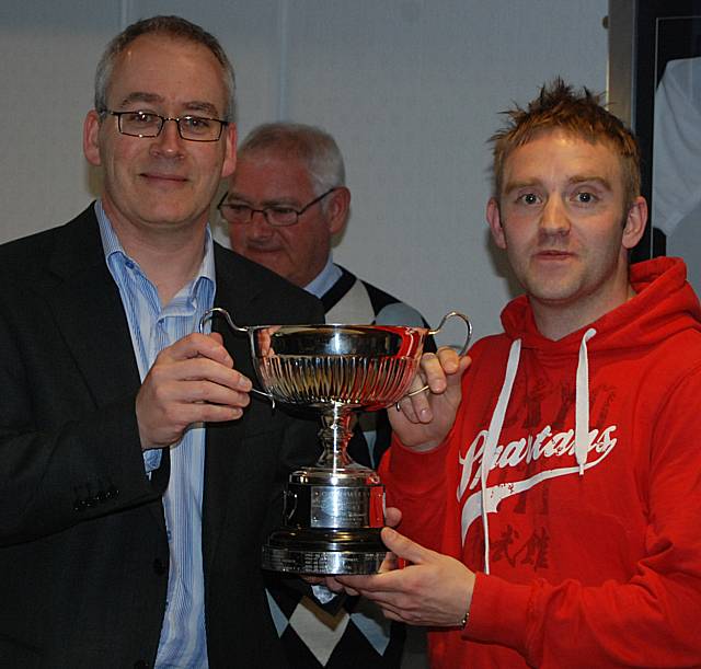 Rochdale Online director Ian Kimber presents Bricklayers captain Nick Dowsing with the runners-up trophy.