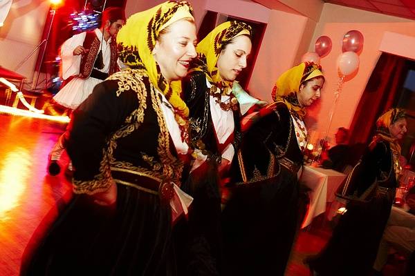 Greek dancing to live Bouzouki music at the chairty night in Littleborough.