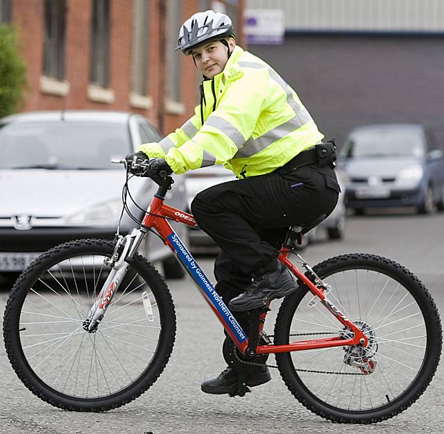 PCSO Jennifer George on the new bike alongside Guinness Northern Counties' Craig Warren and Lorraine Sykes.