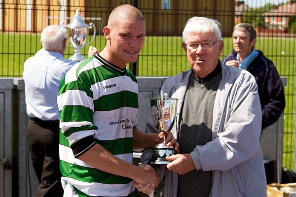 RDSFL President Eddie Melvin presents Catholic Club captain Lee Leonard with the runners up trophy