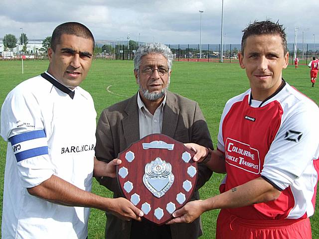 The two team captains with the Alliance shield ahead of last year's game.