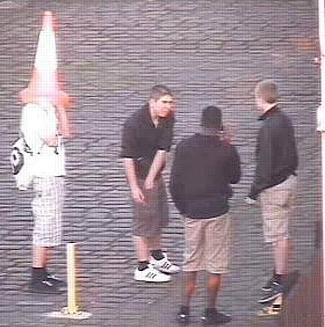 CCTV still of youths trespassing at Heywood Railway Station.