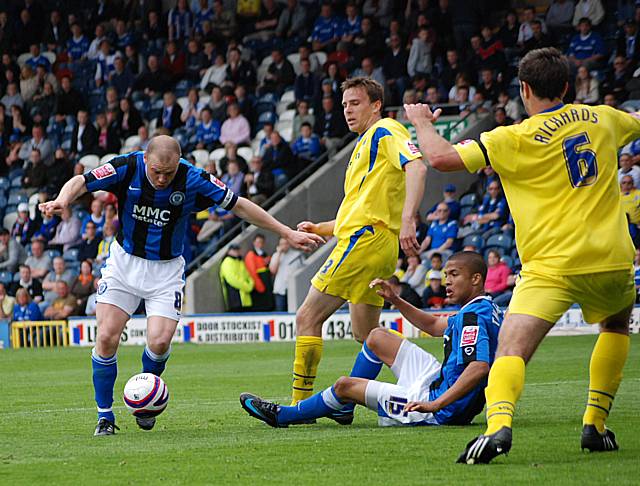 Gary Jones' volley is somehow blocked by Richards.