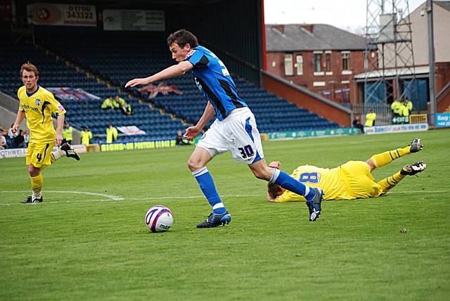 Buckley bursts into the box but can't finish.