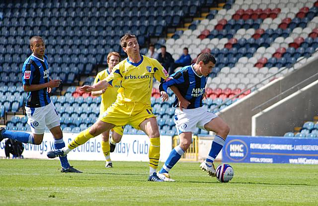 Adam Rundle sprints past Nicky Southall.