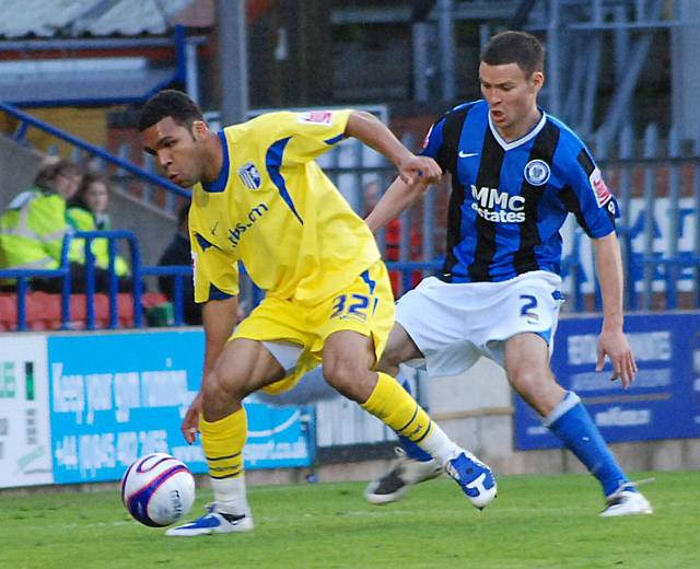 Simon Ramsden puts pressure on Andy Barcham.