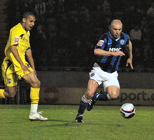 Gary Jones gets away from Curtis Weston.