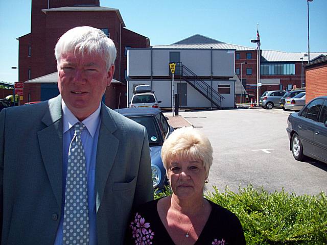 Rochdale MP Paul Rowen with Councillor Jean Ashworth and the cabins occupying disabled bays in the background.