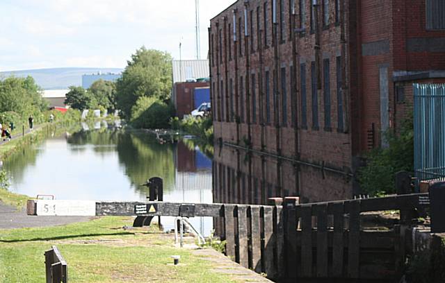 Overboard: The man was thrown into the canal after an early morning fight, starting in the Co-op