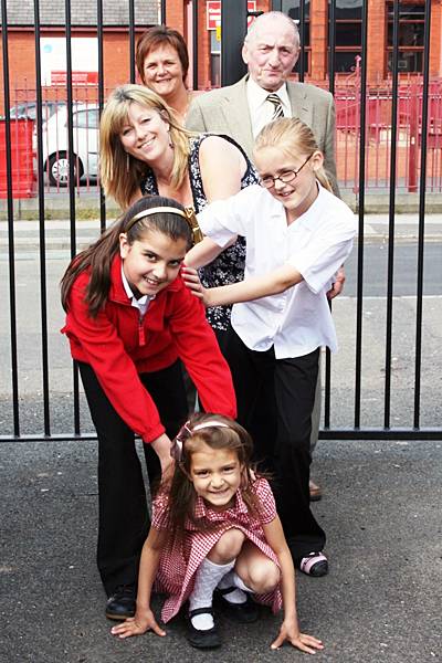 Alliyya Dutt, 5; Aanisaa Dutt, 10; Elizabeth Andrews, 10, Yvonne Bennett, Assistant Burglary Reduction Officer at Rochdale Borough Council, Cllr Ted Flynn, Cabinet member for community safety, Rachel Andrews, Street Representative