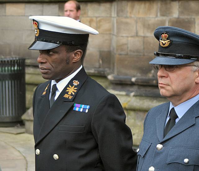 Servicemen at the flag raising.