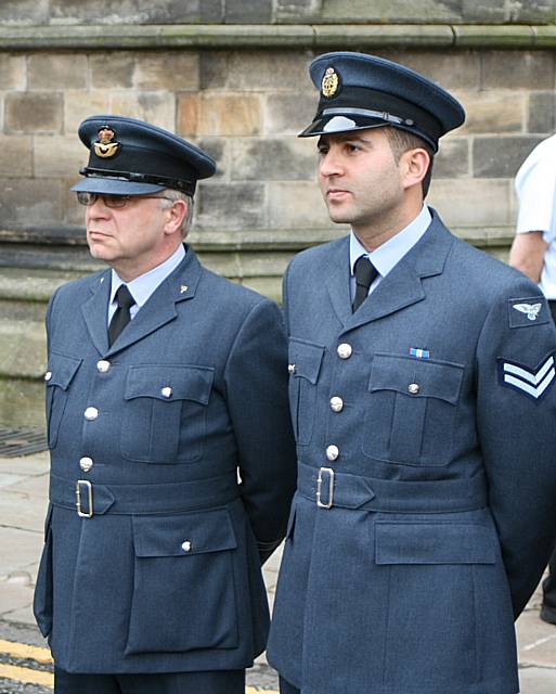 Servicemen at the flag raising.