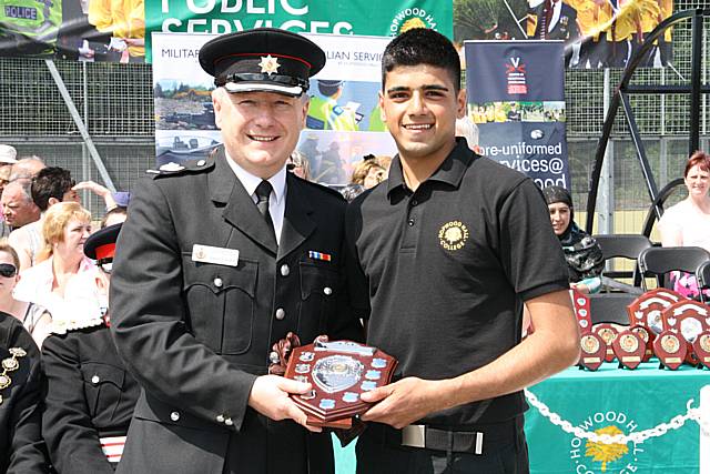 GM Fire and Rescue Service Borough Commander Martyn Ward gives Level 2 student Summander Hussain his award for “best endeavour”.