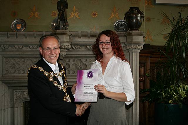 Rochdale town centre ambassadors take their award from the Mayor of Rochdale, Councillor Keith Swift