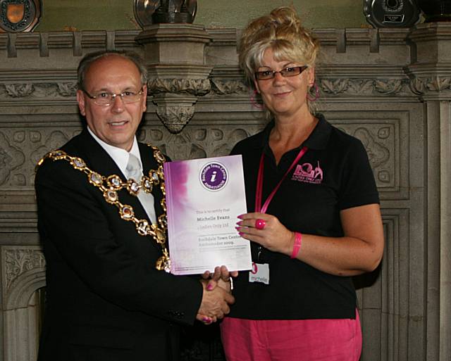 Rochdale town centre ambassadors take their award from the Mayor of Rochdale, Councillor Keith Swift