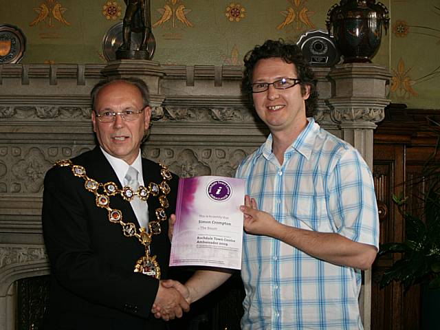 Rochdale town centre ambassadors take their award from the Mayor of Rochdale, Councillor Keith Swift