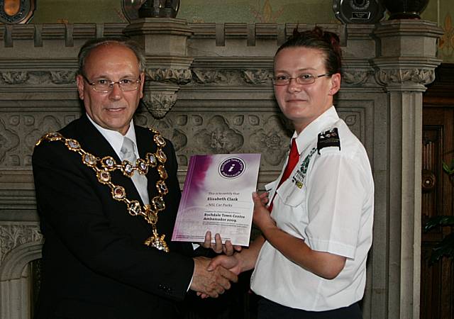 Rochdale town centre ambassadors take their award from the Mayor of Rochdale, Councillor Keith Swift