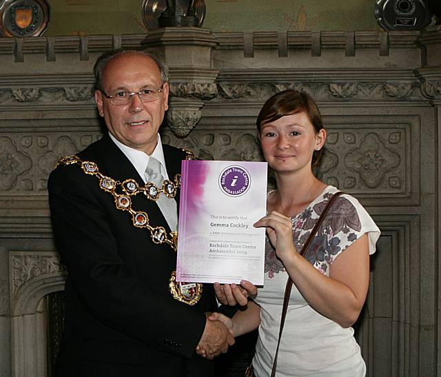 Rochdale town centre ambassadors take their award from the Mayor of Rochdale, Councillor Keith Swift