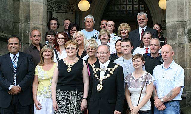 Rochdale town centre ambassadors take their award from the Mayor of Rochdale, Councillor Keith Swift