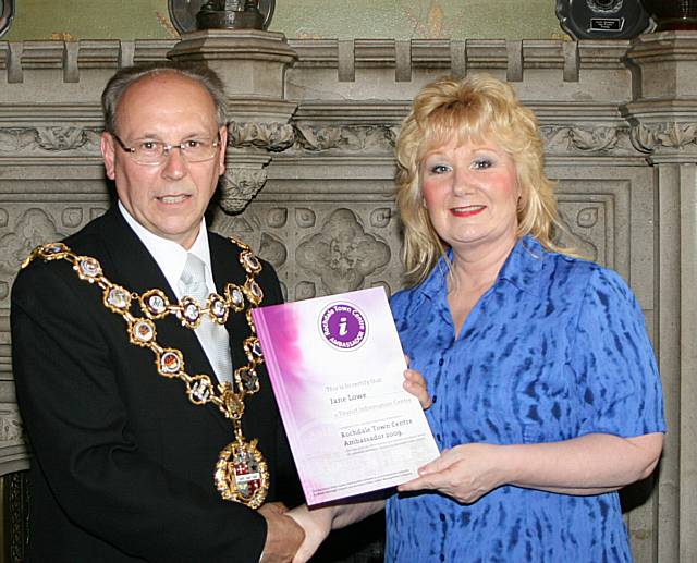 Rochdale town centre ambassadors take their award from the Mayor of Rochdale, Councillor Keith Swift