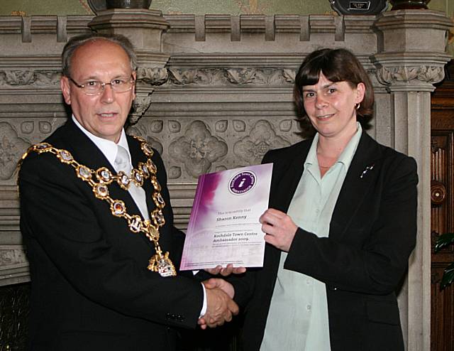 Rochdale town centre ambassadors take their award from the Mayor of Rochdale, Councillor Keith Swift