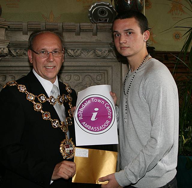 Rochdale town centre ambassadors take their award from the Mayor of Rochdale, Councillor Keith Swift