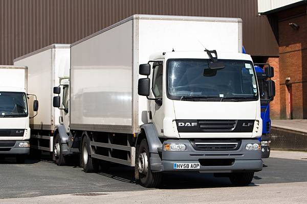 Heavy goods vehicles unloading at the site