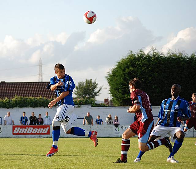 Le Fondre flicks the ball on.